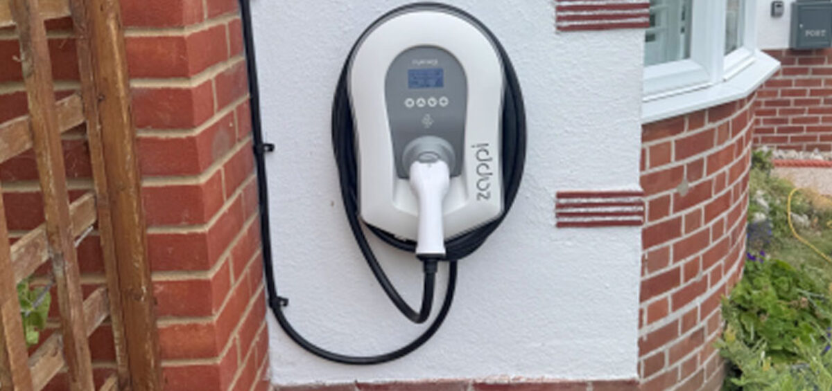 Domestic Zappi EV charger installation on rendered wall
