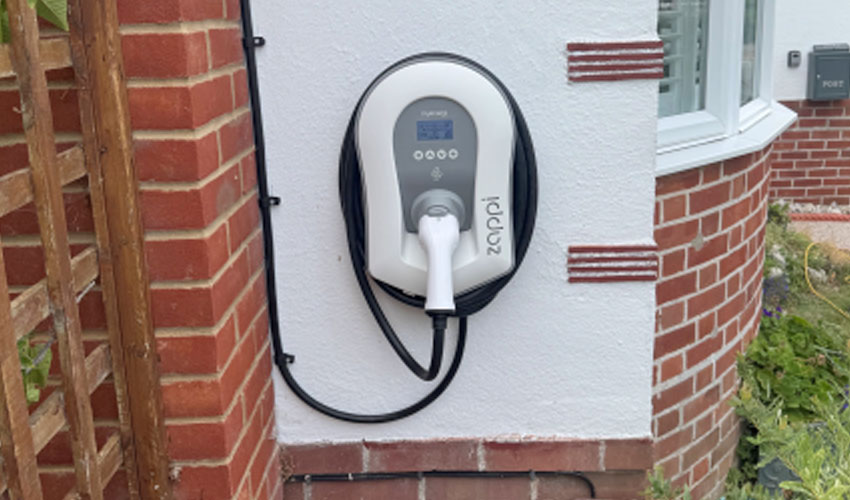 Domestic Zappi EV charger installation on rendered wall